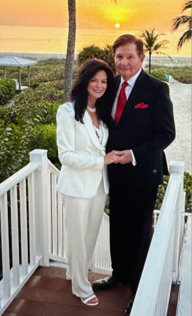 Frank and JoAnne Noyes with a tropical sunset in the background. Frank and JoAnne Noyes with a tropical sunset in the background.
